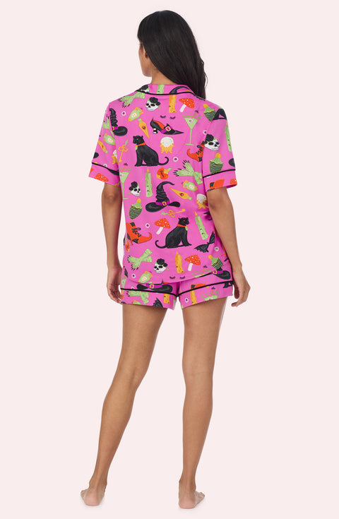 A Lady Wearing Siennna Short Knit Pj Set In Potion Commotion in a back view pose