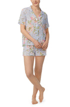 A lady wearing blue short sleeve florence pj set in blooming bride.