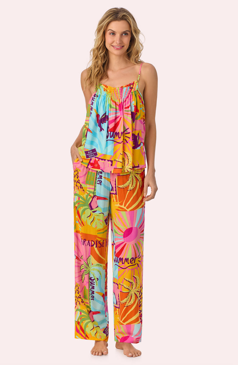A lady wearing Alia Woven Pj Set In Sunset Greeting