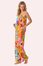 A lady wearing Alia Woven Pj Set In Sunset Greeting