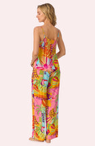 A lady wearing Alia Woven Pj Set In Sunset Greeting
