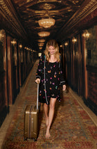 A lady wearing Remi Knit Robe And Chemise Set In Midnight Butterfly