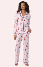A Lady Wearing Collette Knit Pj Set In Sippin' With Santa