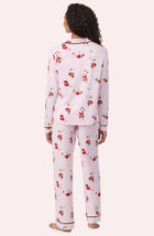 A Lady Wearing Collette Knit Pj Set In Sippin' With Santa in a back view pose