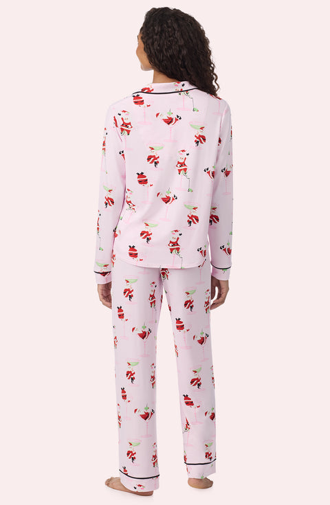 A Lady Wearing Collette Knit Pj Set In Sippin' With Santa in a back view pose