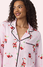 A Lady Wearing Collette Knit Pj Set In Sippin' With Santa in a front view close up look