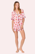 A lady wearing Aspen Pj Set In Giraffes On Pointe