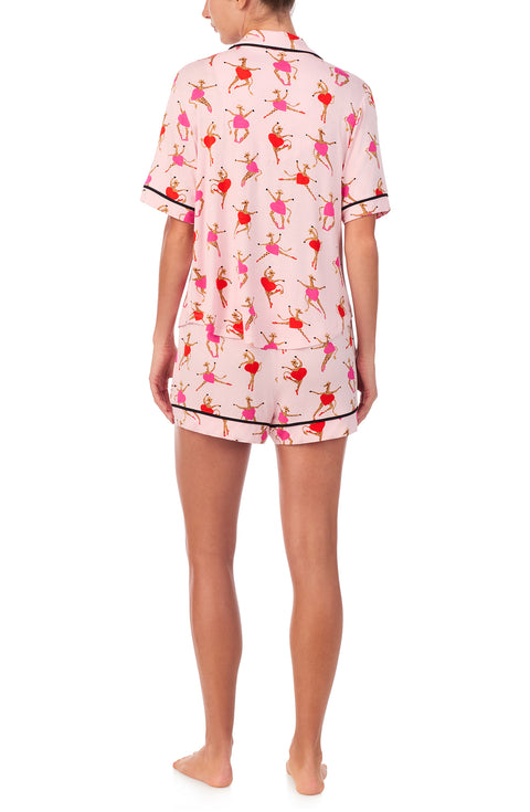 A lady wearing Aspen Pj Set In Giraffes On Pointe