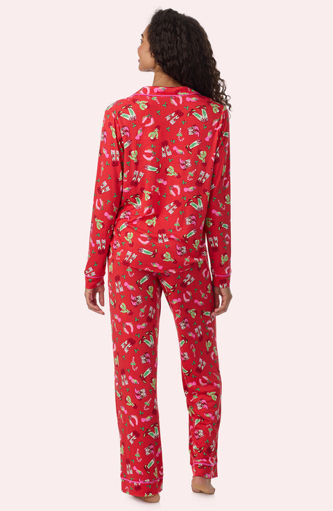 A Lady Wearing Collette Knit Pj Set In Country Claus in a back view pose