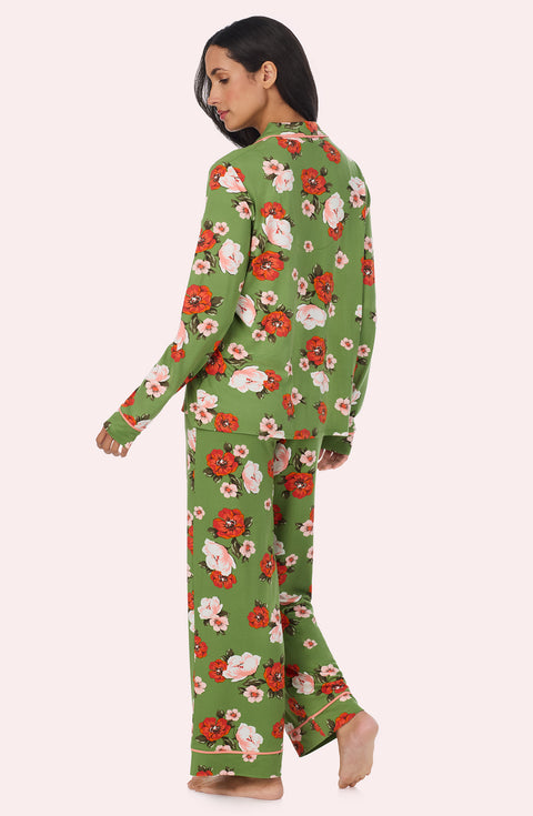 A Lady Wearing Stella Knit Pj Set In Autumn Blooms standing in a back view pose while looking to the side