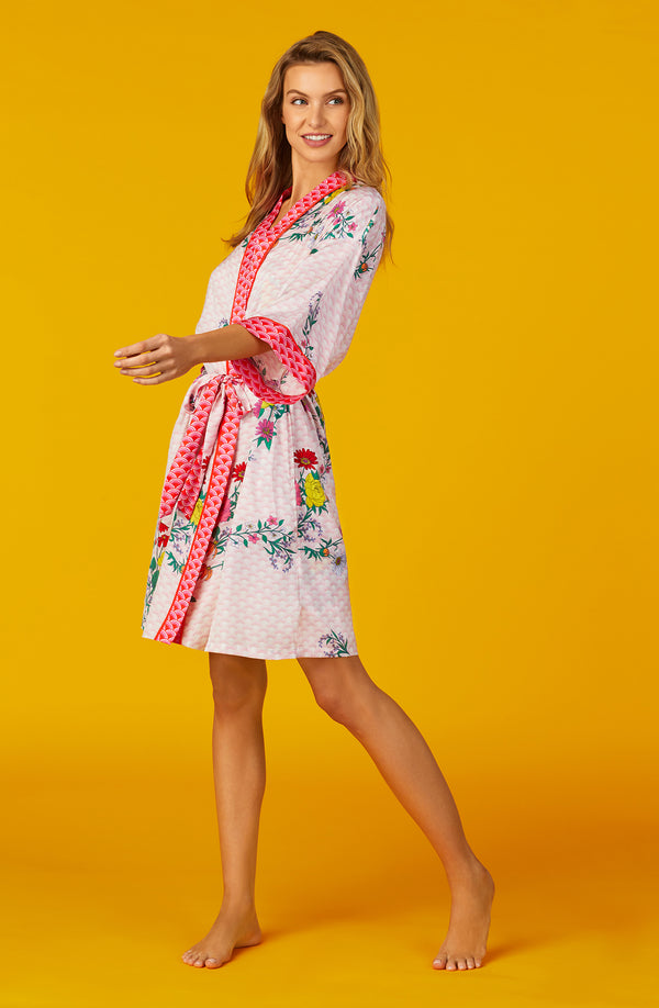 A lady wearing pink quarter sleeve Skylar Robe with  Wildflowers print.