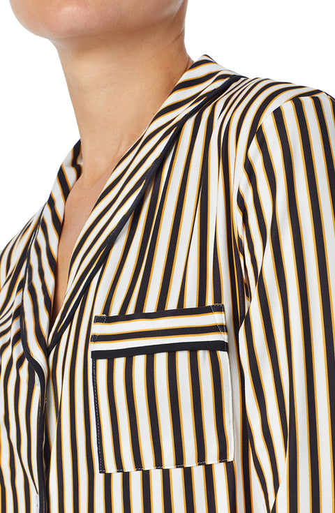 A lady wearing black and white reagent pj set with midnight stripe print.