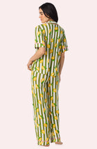 A Lady Wearing Dakota Long Knit Pj Set In Lemonade Stand Stripe posing with a back view