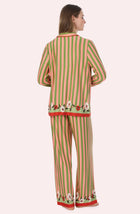 A Lady Wearing Stella Knit Pj Set In Stripes & Stems standing in a back view pose