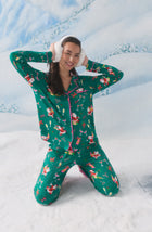 A Lady Wearing Collette Knit Pj Set In Merry Mixology while wearing stylish winter snow headphones