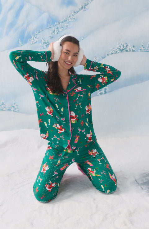 A Lady Wearing Collette Knit Pj Set In Merry Mixology while wearing stylish winter snow headphones