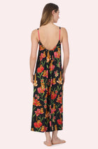A Lady Wearing Avery Knit Chemise In Flora & Fierce standing in a back view pose