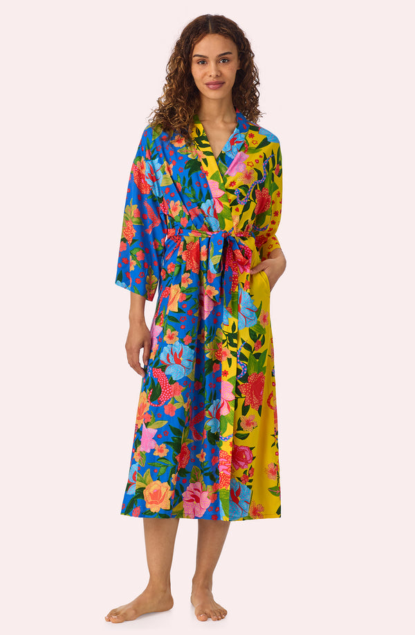A lady wearing Erica Woven Robe In Paradise Vacay