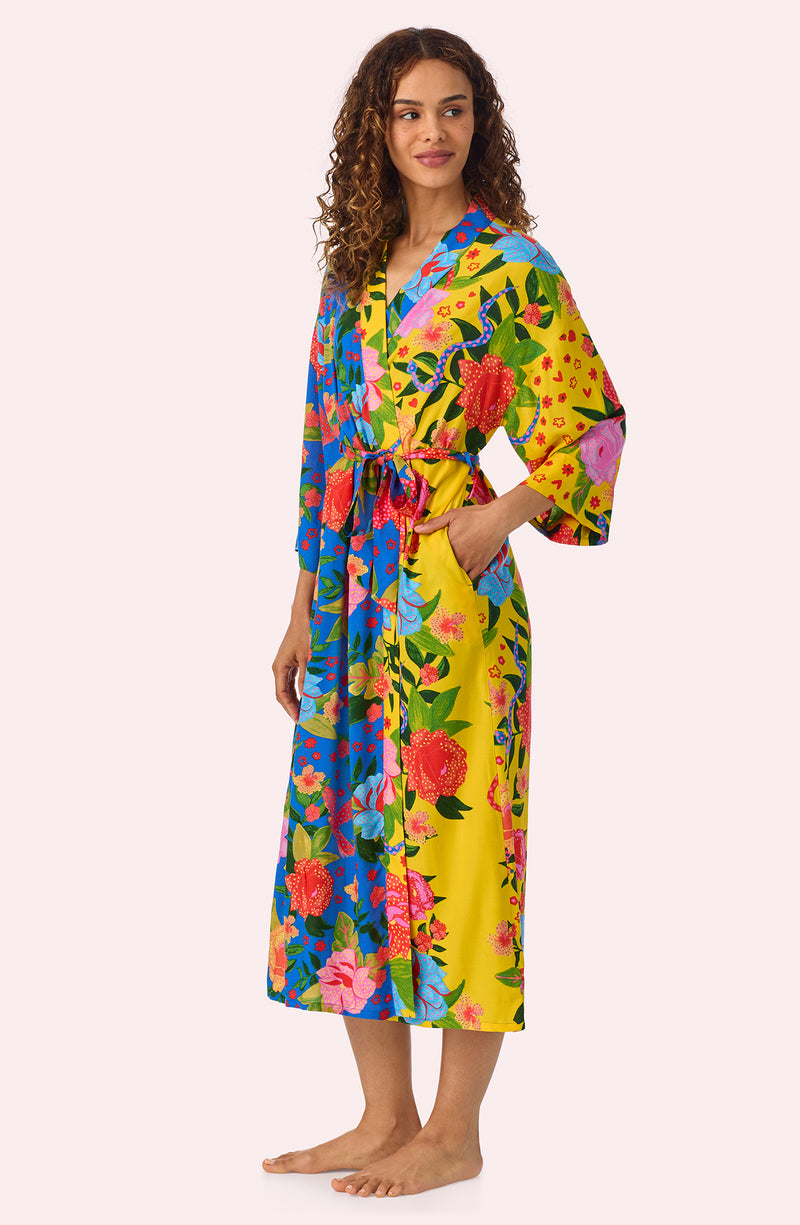 A lady wearing Erica Woven Robe In Paradise Vacay