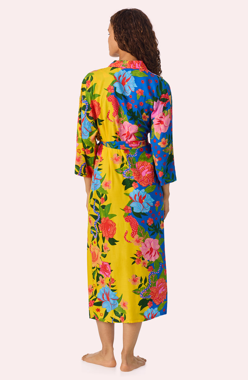 A lady wearing Erica Woven Robe In Paradise Vacay