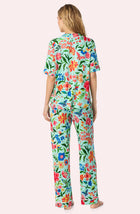 A Lady Wearing Dakota Long Knit Pj Set In Aqua Fleur posing back view