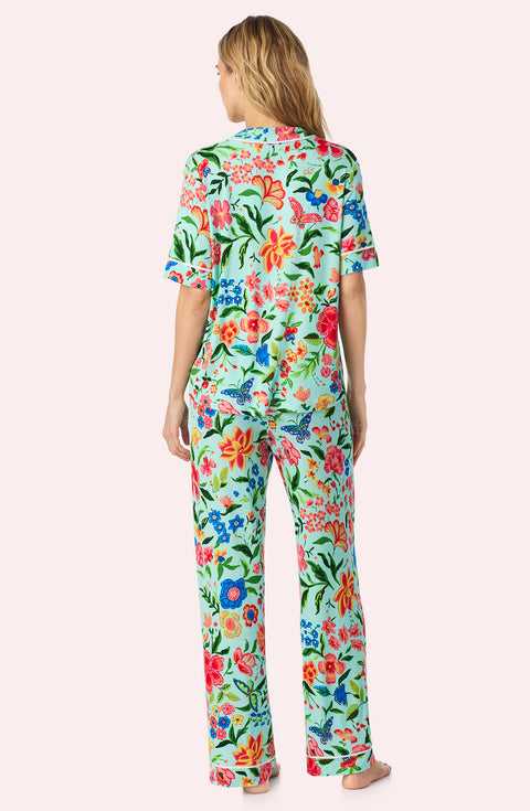 A Lady Wearing Dakota Long Knit Pj Set In Aqua Fleur posing back view