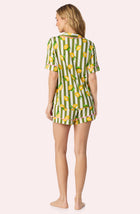 A Lady Wearing Dakota Short Knit Pj Set In Lemonade Stand Stripe posing back view
