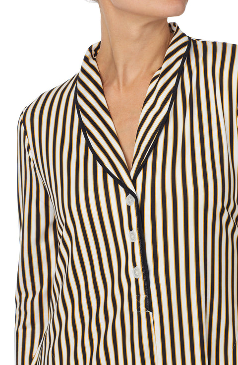 A lady wearing black and white sutton sleepshirt with midnight stripe print.