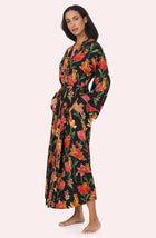 A Lady Wearing Madilyn Knit Robe In Flora & Fierce standing in a side angled view pose