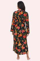 A Lady Wearing Madilyn Knit Robe In Flora & Fierce standing in a back view pose