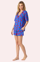 A Lady Wearing Dakota Short Knit Pj Set In Cherry Kisses posing with a side angle view