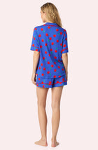 A Lady Wearing Dakota Short Knit Pj Set In Cherry Kisses posing with a back view