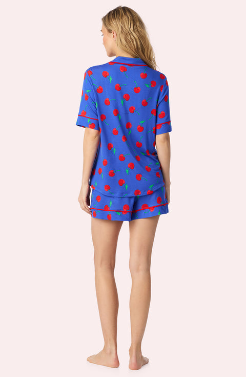 A Lady Wearing Dakota Short Knit Pj Set In Cherry Kisses posing with a back view