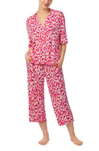 A lady wearing pink quarter sleeve cropped kiara pj set in feline fuchsia.