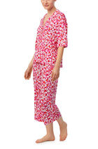 A lady wearing pink quarter sleeve cropped kiara pj set in feline fuchsia.