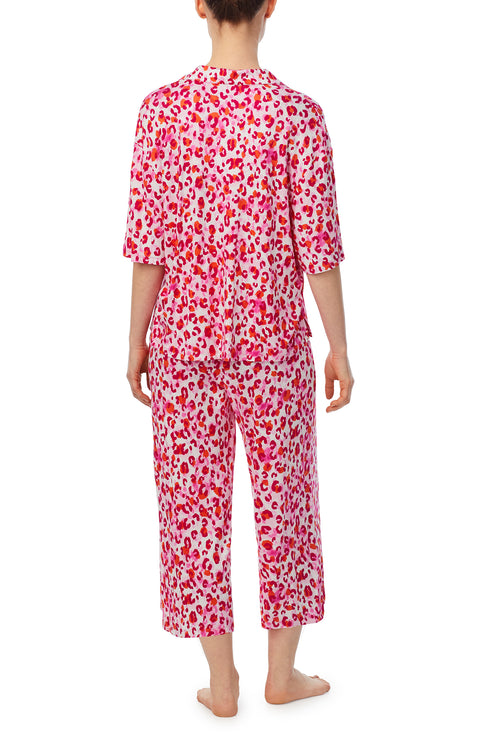 A lady wearing pink quarter sleeve cropped kiara pj set in feline fuchsia.