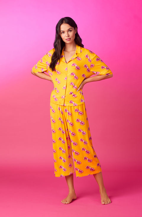 A lady wearing quarter sleeve cropped kiara pj set in sunny honey.