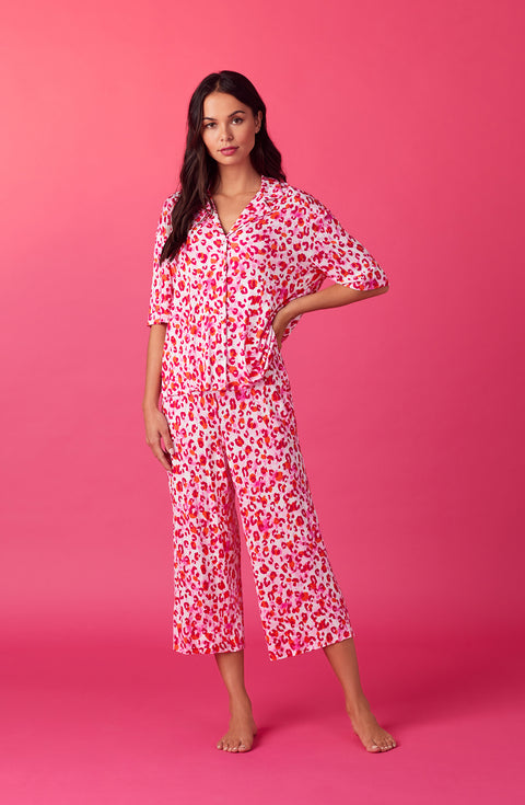 A lady wearing pink quarter sleeve cropped kiara pj set in feline fuchsia.