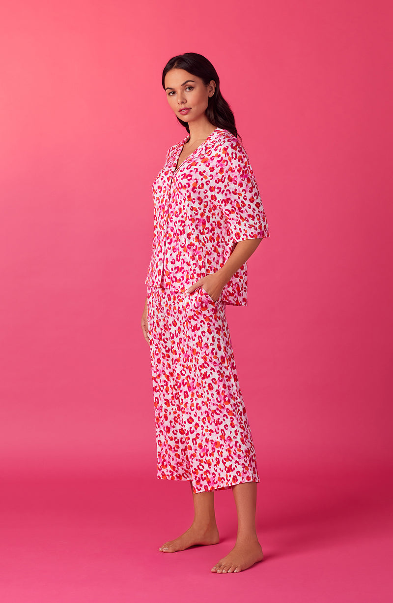 A lady wearing pink quarter sleeve cropped kiara pj set in feline fuchsia.