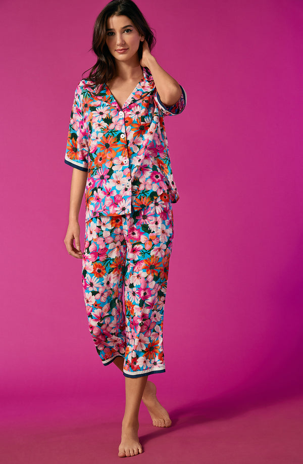 A lady wearing a multi colour floral cropped pajama set.