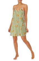 A girl wearing a sleeveless chemise with cheetah and stripes design.