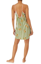 A girl wearing a sleeveless chemise with cheetah and stripes design.