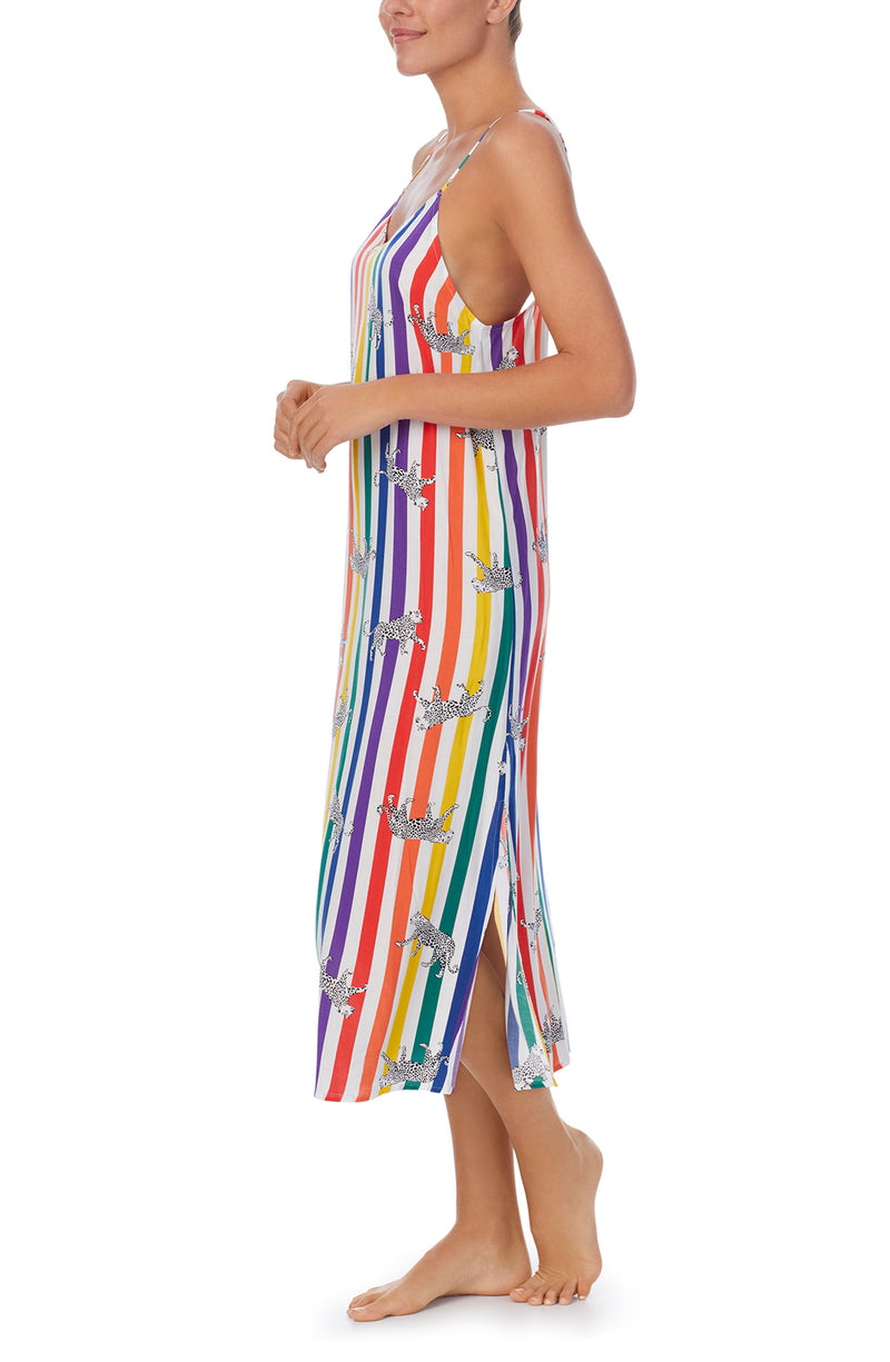 A lady wearing a pride sleeveless long maxi dress with prowling pattern.