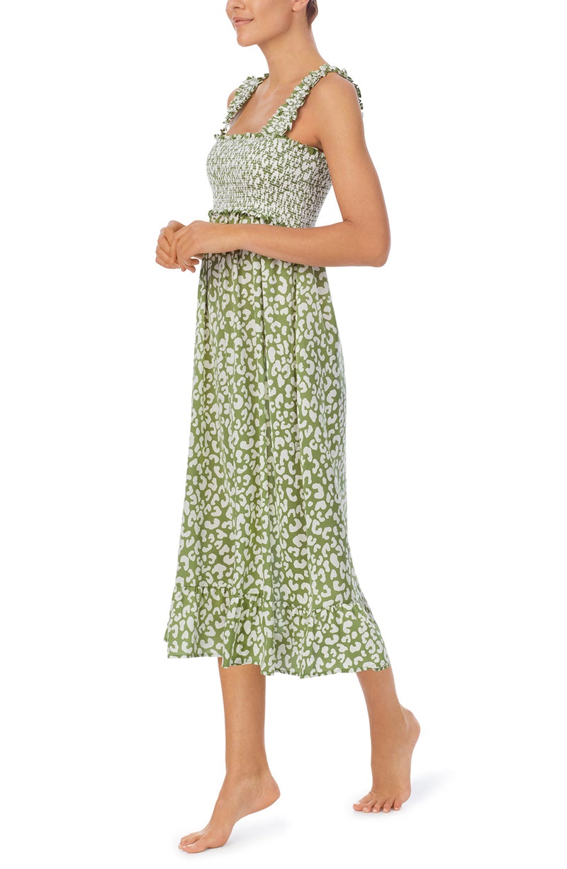 A lady wearing a olive midi dress with leopard print pattern.
