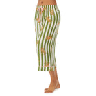 Bottom part of a girl wearing white cropped pant with Cheetahs & Green Stripes
