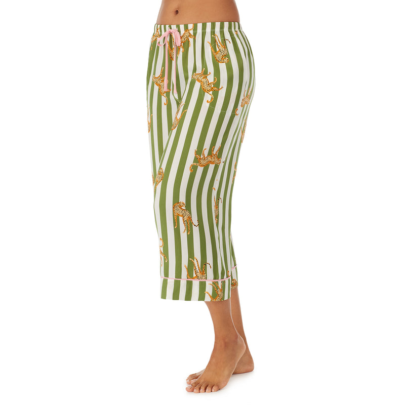 Bottom part of a girl wearing white cropped pant with Cheetahs & Green Stripes