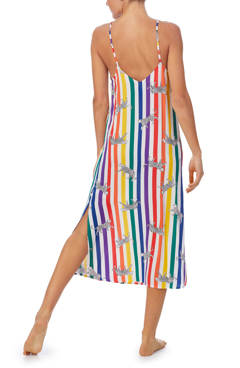 A lady wearing a pride sleeveless long maxi dress with prowling pattern.