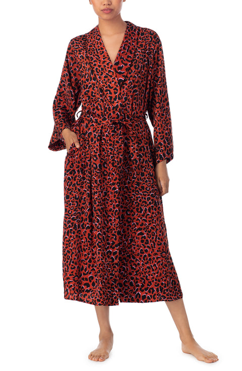 A lady wearing a long sleeve maxi robe with rustic animal pattern.