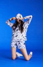 Girl is wearing black and white Tie Die Short.