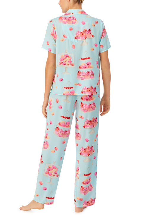 A lady wearing blue short sleeve madison pj set with sweet dreams print.
